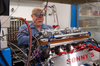 Tom working with an engine on the Dyno. With 2 dynos running, Sonny's has thousands of hours of R&D in engine combinations. Sonny's is leading the way on the popular Electronic Fuel Injection combination, as shown in this picture. 