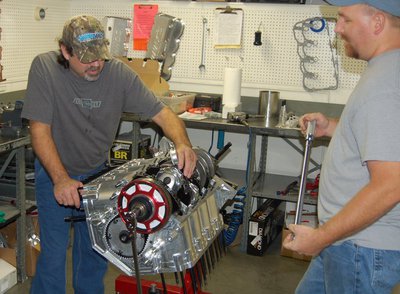 Rusty and Chuck assembling an engine, checking rod bolt stretch